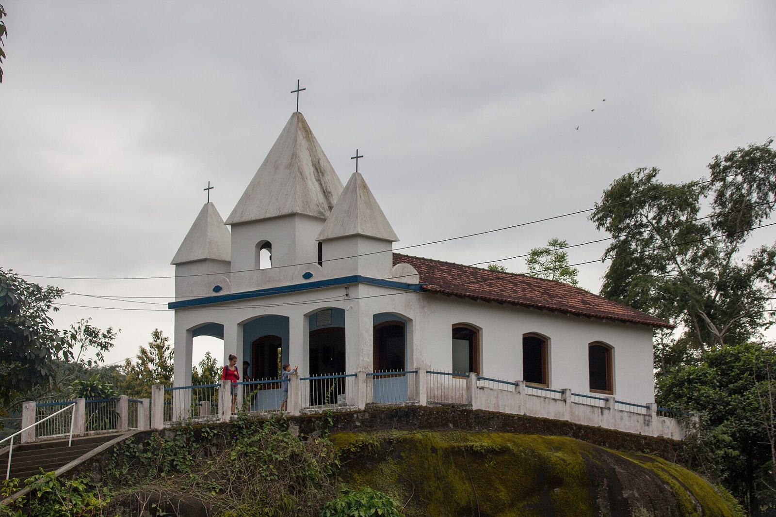 The white Igreja de Nossa Senhora da Penha standing on its green hill above the valley.