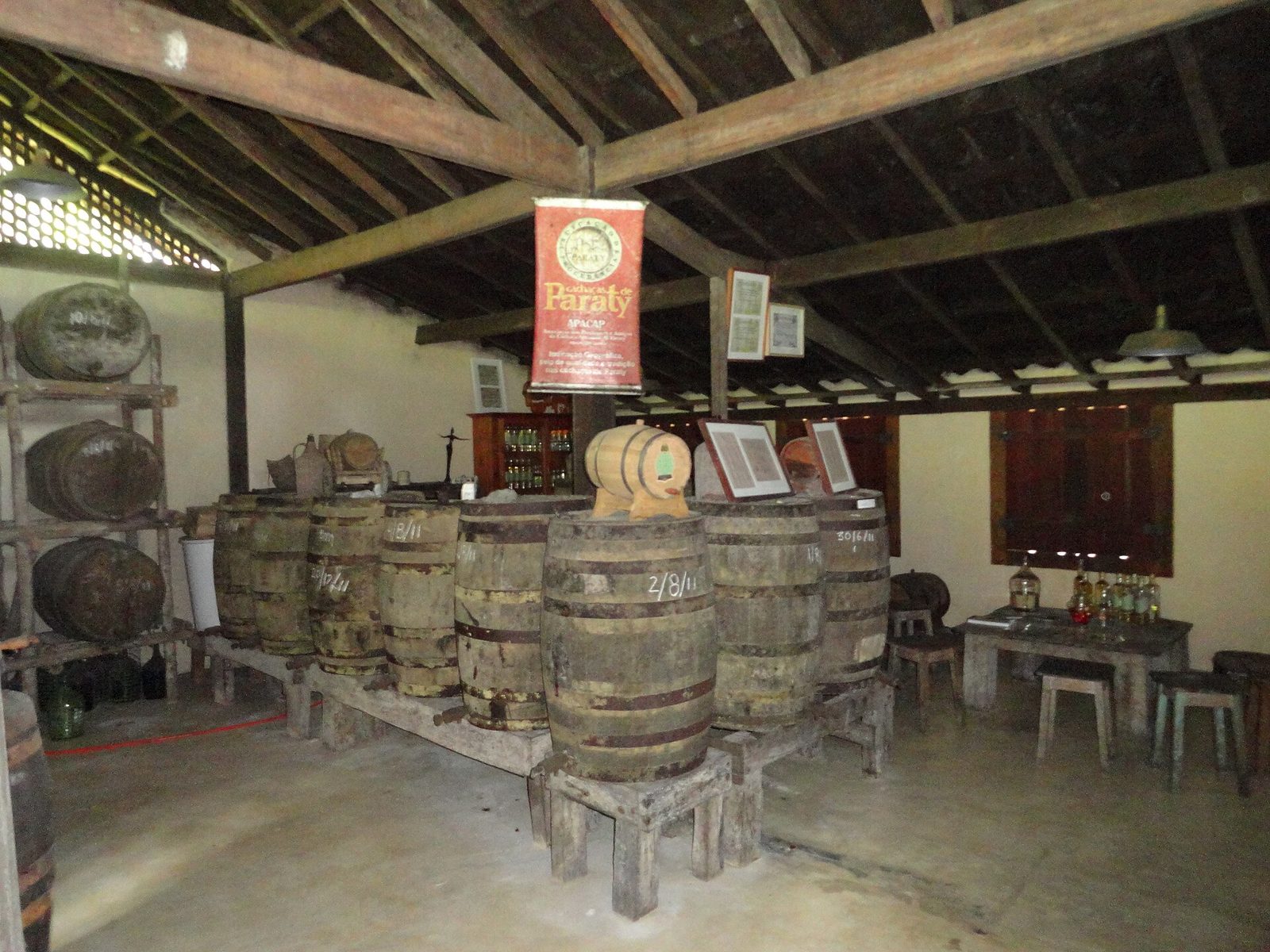 The barrel-and-still room inside a Paraty distillery, where the spirit is made and left to rest in wood.